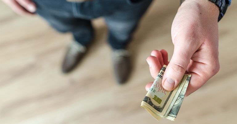 Man handing money