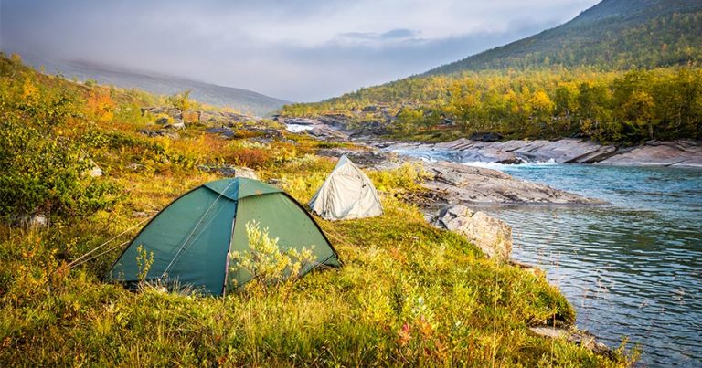 Tents on riverbank