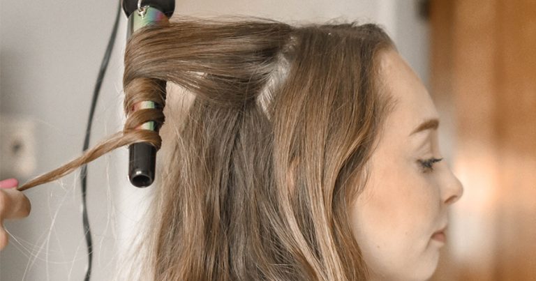 Woman getting her hair curled
