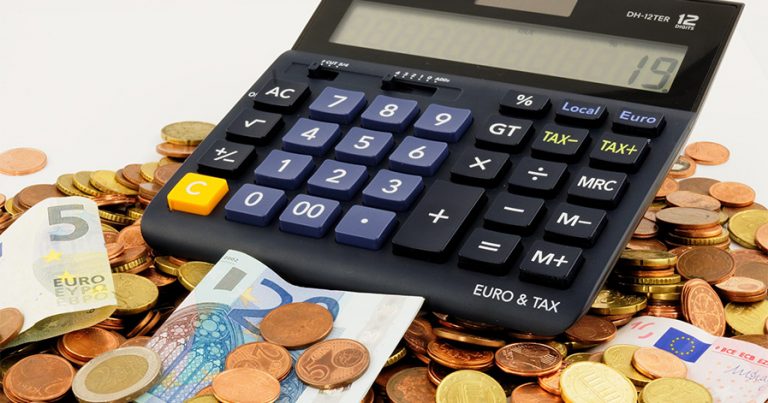 Calculator on a pile of money