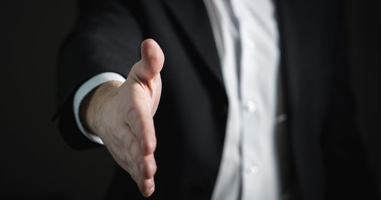 Businessman extending hand for handshake
