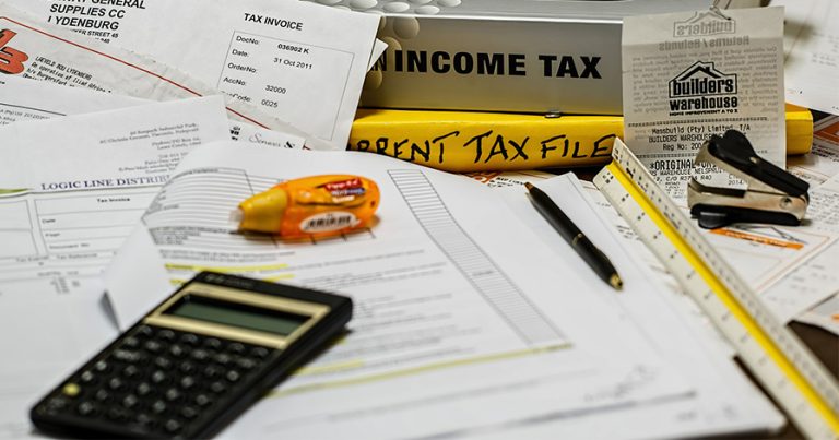 Calculator, tax files, white out