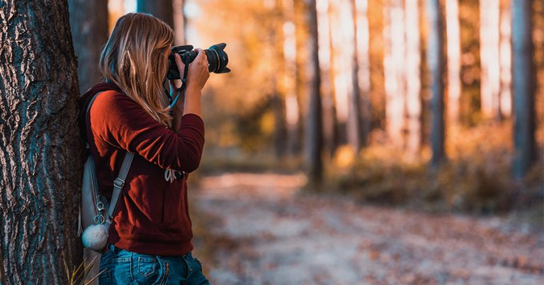 Woman taking photos outside