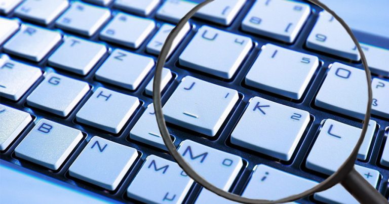 Magnifying glass on a keyboard