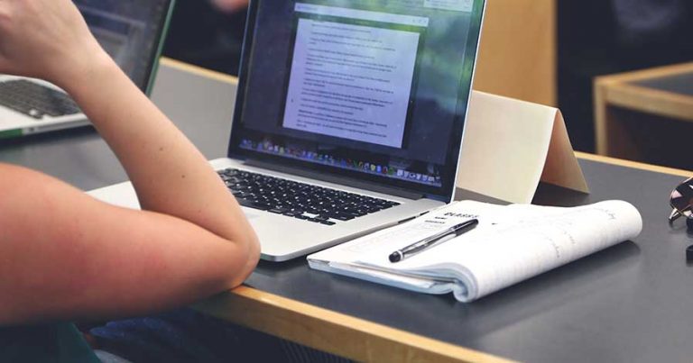 A person studying on their laptop