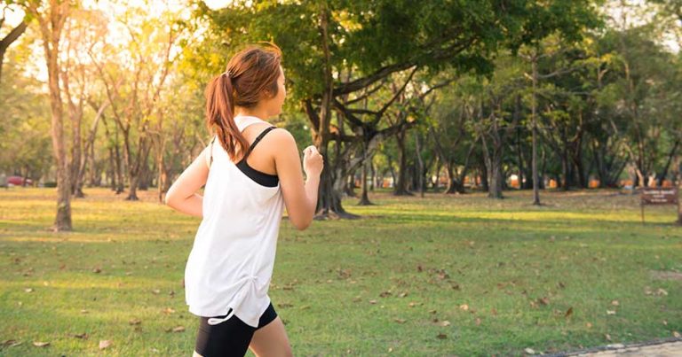 A woman running through a park