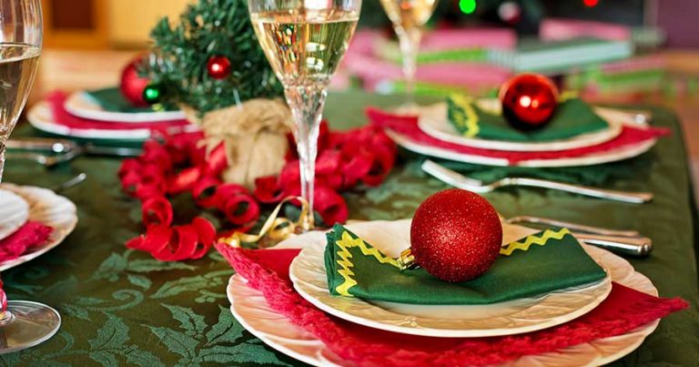 A table set for Christmas dinner, with decorations