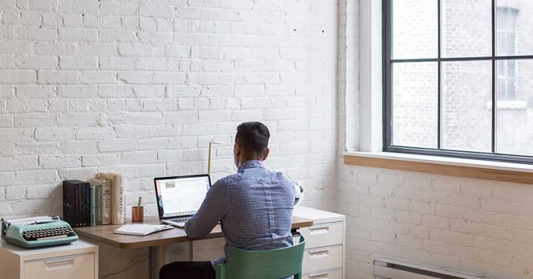 A man sitting in his home office