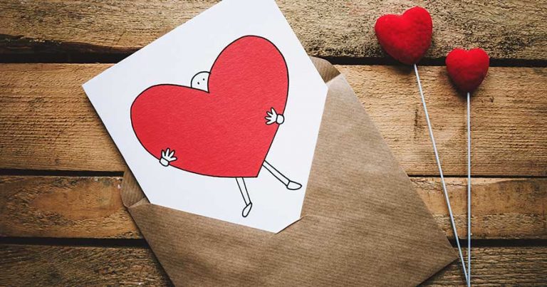 A Valentine's Day card laying on a table.