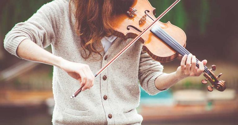 A woman playing the violin