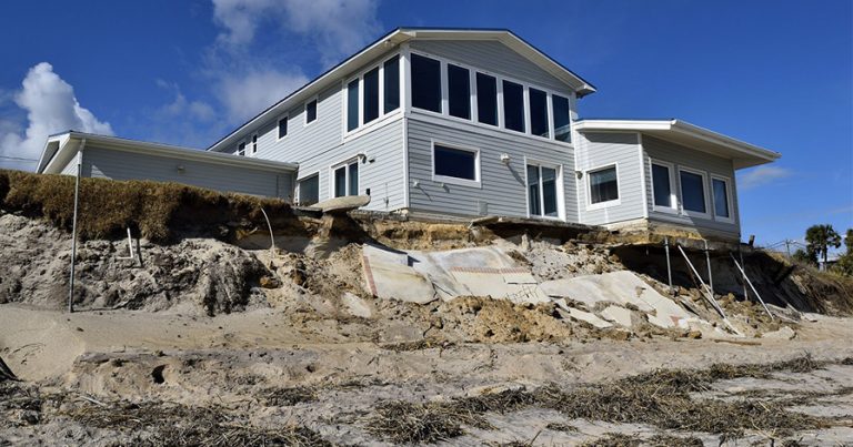 Beach erosion in front of home after hurricane