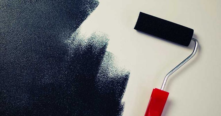 A white wall being painted black