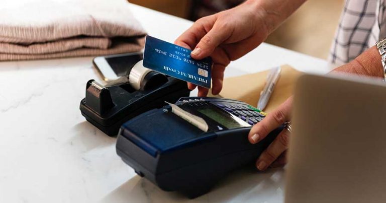 Someone paying with a credit card at a store
