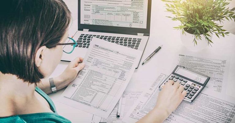 A woman preparing her taxes
