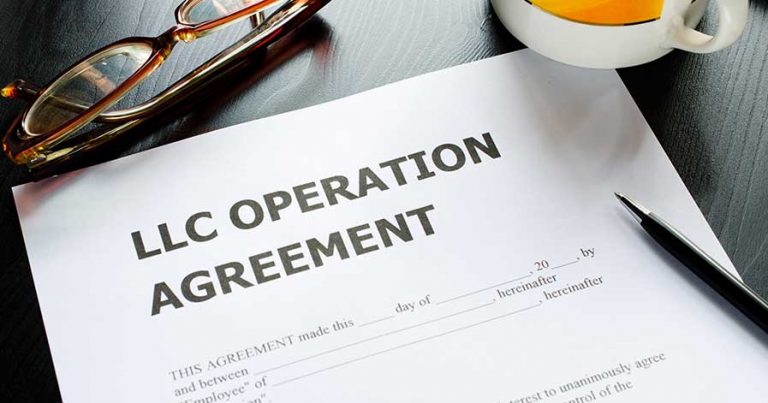 LLC agreement forms on a desk