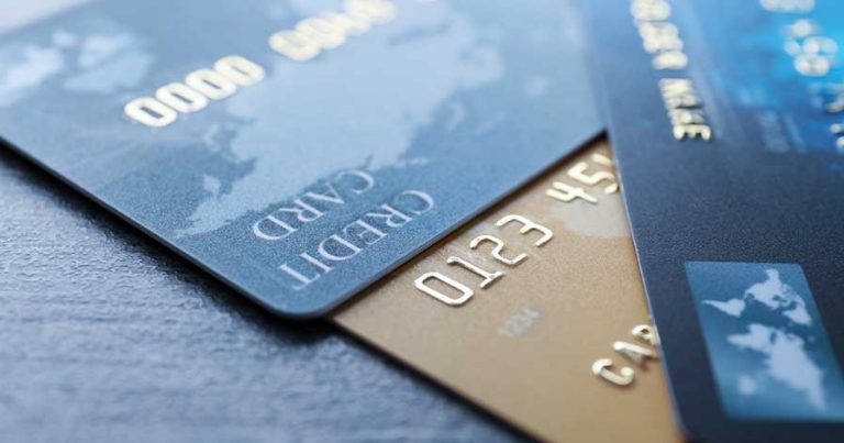 Three different credit cards on a table