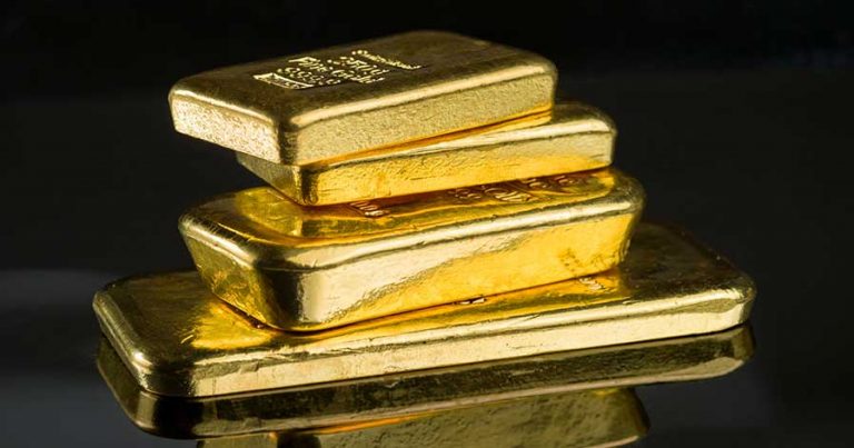 Gold bars stacked on a table