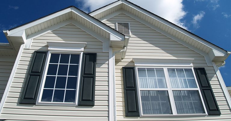 Vinyl shutters on windows of a house
