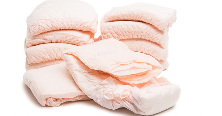 Twp stacks of adult diapers