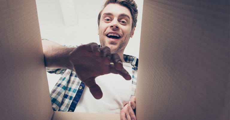 Man looking inside a box