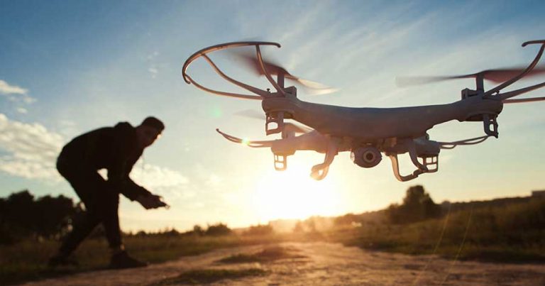 A person flying a drone outside