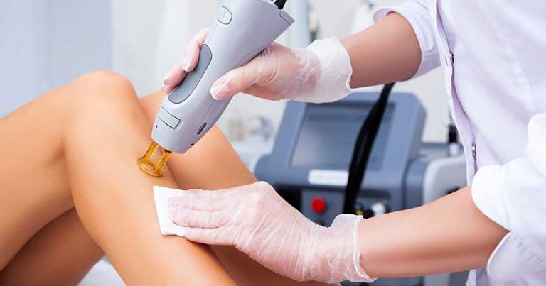 A woman having laser hair removal done on her legs
